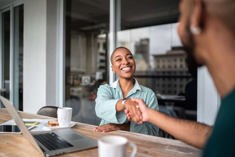 shaking hands with a customer